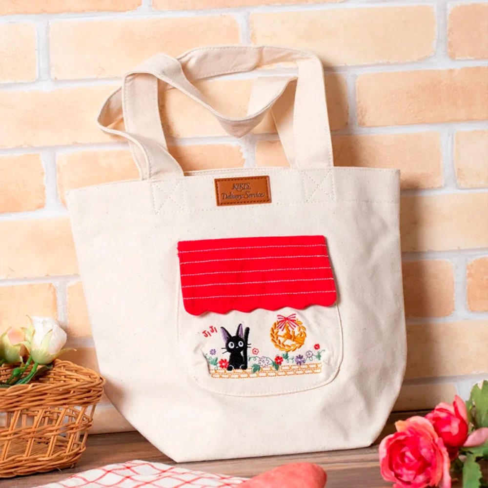 NICKY, LA APRENDIZ DE BRUJA - BOLSO CON ASAS "JIJI ENTRE FLORES"